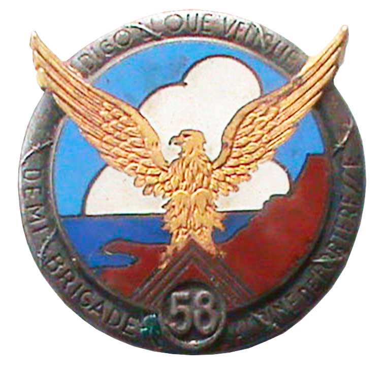 Ligne Maginot - Insigne de la 58° Demi Brigade Alpine de Forteresse (DBAF) - Portant l'inscription 'Digon que vengue' qui signifie 'Dis lui qu'il  vienne'
Fabrication Drago
