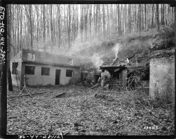 Ligne Maginot - SCHIMBERG (SOUS-SECTEUR BITCHE - 37° RIF) - (PC de Sous-Secteur) -  'Infantryman of Co. G, 2nd Battalion, 398th Regiment, 100th Division, stands on guard in front of the telephone trunk terminal, outside his Company's Forward Command Post, inside the fortifications on the Maginot Line near Bitche, France.'

SC 332213, Credit NARA.